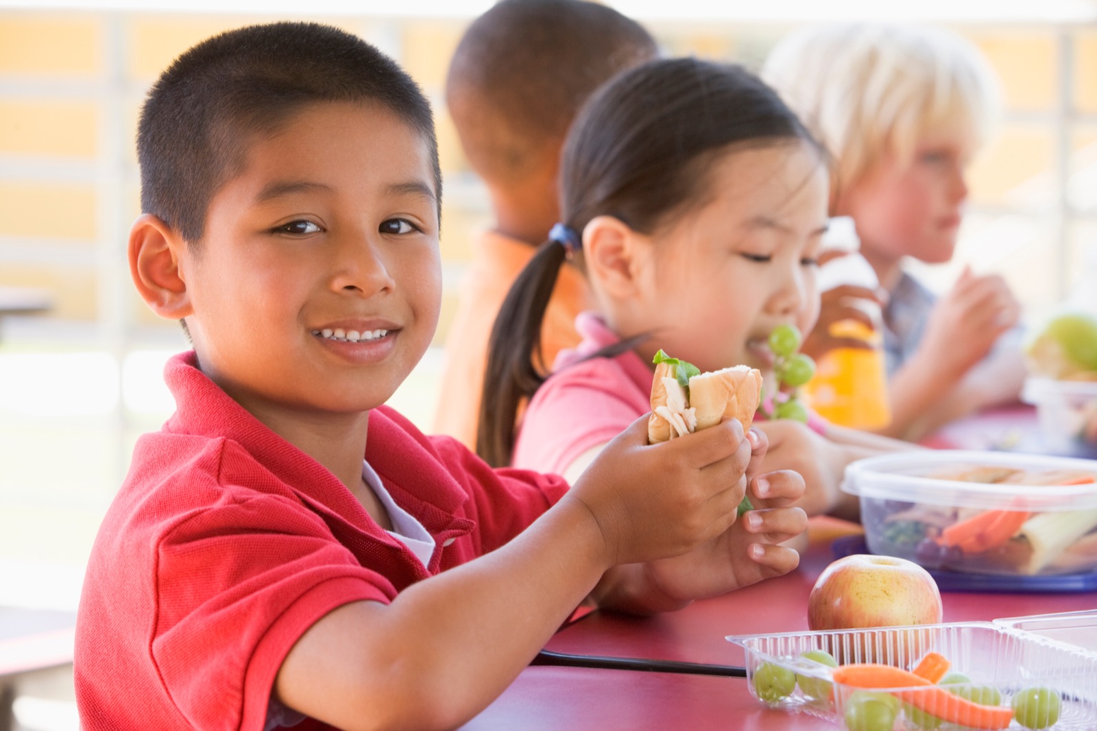 A child enjoying a meal at a table