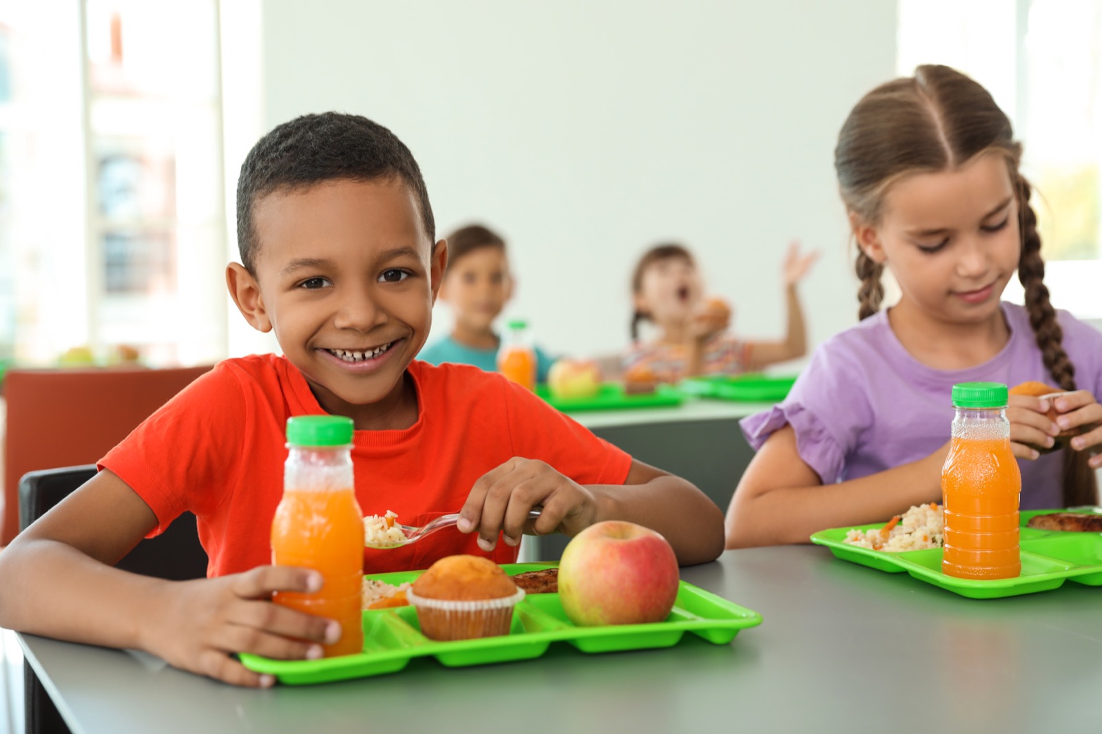 Children gathered around a shared meal